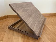 a wooden table sitting on top of a hard wood floor