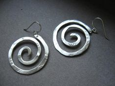 The spiral is a sacred symbol that represents the journey and change of life as it unfolds. it can represent consciousness of nature beginning from it's center expanding outward. The spiral is also part of the spiral goddess symbol which represents our internal feminine power.These swirl hoops are hand pound, shaped and polished. Ear wires are sterling silver. Great for every day. The texture and hand forged quality catches the light and give these simple earrings dimension. Ancient spiral meani Change Of Life, Spiral Goddess, Goddess Symbol, Goddess Earrings, Spiral Jewelry, Goddess Symbols, Swirl Earrings, Sacred Symbols, Feminine Power