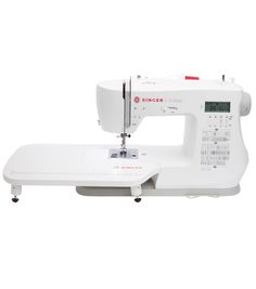 the singer sewing machine is white and has red lettering on it's side,