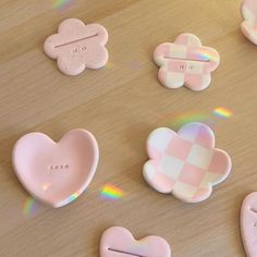 some pink and white heart shaped cookies on a table