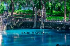 the words radum springs are in front of a lake and trees with benches