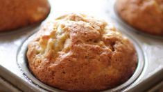 some muffins are sitting in a metal pan