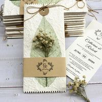 the wedding stationery is laid out on top of each other and tied with twine