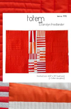 an orange and white quilt with the words, totemm written in red on it