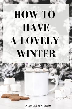 a white mug with marshmallows on the side and text overlay that reads how to have a lovely winter