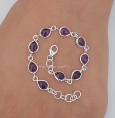 Amethyst Bracelet / 925 Sterling Silver Bracelet / February Birthstone Bracelet / Gemstone Bracelet / Handmade Silver Jewelry / Gift For Her Gemstone Name - Amethyst  Stone Quality - AAA Bracelet Weight - 4.27 gm Stone length :- 7 MM, Stone Width :- 5 MM Bracelet Length - 6 inch to 9 inch sizes are available, we give 0.5 inch adjustable in the size which you order ( NOTE - 0.5 INCH ADJUSTABLE IS INCLUDED IN YOUR ORDERED SIZE ) Stone Shape - As shown in the picture You'll get the exact product as shown in the pictures We serve complete 925 sterling silver Jewelry and genuine properties of the stone. The products are dispatched from the small business from USA. Product Quality and Packaging - Our all products are 925 Silver Stamped which shows that the product is genuine and authentic .The p Purple Sterling Silver Round Bracelets, Purple Sterling Silver Round Bracelet, Adjustable Purple Sterling Silver Bracelet, Sterling Silver Crystal Bracelet With Natural Stones, Sterling Silver Gemstone Chain Bracelet As Gift, Silver Amethyst Bracelets With Stones, Dainty Sterling Silver Crystal Gemstone Bracelet, Dainty Sterling Silver Gemstone Crystal Bracelet, Sterling Silver Stone Bracelets As Gift