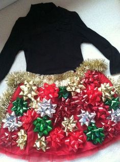 a skirt made out of bows and tinsel on the bottom is red, white and green