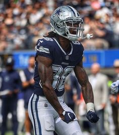 a football player is holding the ball in his hand