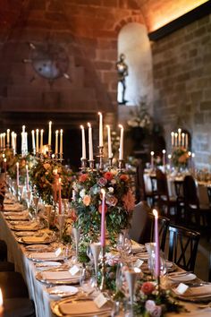 a long table is set with candles and flowers for an elegant dinner or party event