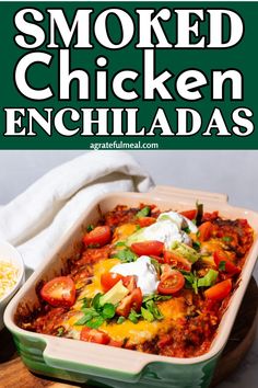 a green casserole dish filled with chicken enchiladas and topped with sour cream