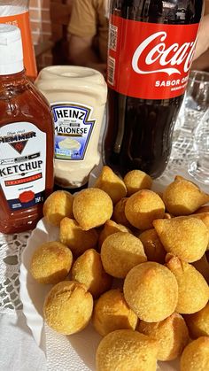 some food is sitting on a table with sauces and ketchup in the background