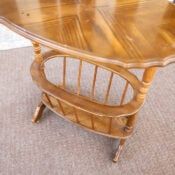 a wooden table sitting on top of a carpeted floor