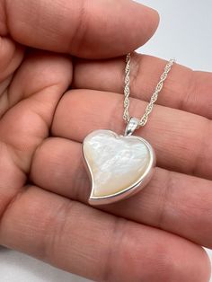 This is the perfect gift and a unique way to carry your loved ones close to your heart. You can access the compartment in the pendant through the top. The bail unscrews. ❤️Size: 1" L x .75" W ❤️Material:925 sterling silver; ❤️Free Engraving available: the back can be personalized with engraving message. 16 characters max. ❤️Included in the package:18" matching chain,gift box, filling funnel kit; ❤️ Care Instructions Though the materials used is made of sterling silver, I recommend you to not sleep, swim, or spray chemicals (i.e. perfumes, lotions, or body spray) on to the necklace to preserve its longevity. Please follow these tips to preserve the longevity of the necklace. To clean, it is best to use a soft microfiber cloth to clean the jewelry from smudges. Urn Pendant, Urn Jewelry, Pearl Stone, Memorial Jewelry, Body Spray, Mother Of Pearl, Lotion, Care Instructions, Gift Box