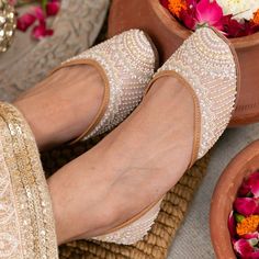 An all-year-round shoe! It's feminine, delicate and subtle. The multi-colour design leaves a lot of room for imagination in terms of styling. Slip these on with a butter-yellow Lucknowi saree or pair them with a blush-coloured kurta...you are sure to cut a dash regardless of how you style these! Outer material: Dupion Inner material: Genuine Leather Color: Blush Pink Type of work: Pearl and glass beads Care: Dry Clean only.If the shoe gets wet, remember to first dry in the sun before putting it back in the closet. Fancy Sandals, Indian Shoes, Women Slippers Fashion, Punjabi Jutti, Bridal Shoes Flats, Bridal Sandals, Hyde Park, Footwear Design Women, Bridal Shoes