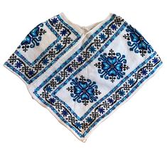 "Wool poncho handmade by the indigenous community of Mazahua. Stay warm in this closed poncho made of natural wool.  The Mazahua's are located in central Mexico and in the regional language of Nahuatl it means \"people of the deer\". Their embroidery is mainly of flowers in different colors." Traditional Blue Poncho, Traditional Blue One-size Poncho, Handmade One-size Folk Poncho, Traditional Woven Shawl Poncho, Artisan Handwoven Poncho, One Size, Traditional Handwoven Poncho One Size, Traditional Handwoven One-size Poncho, Traditional One Size Woven Poncho, Traditional Handwoven Poncho