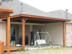 a patio covered in wood and white furniture