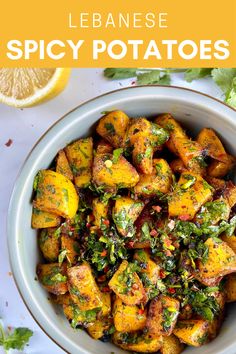 a white bowl filled with cooked potatoes and garnished with cilantro