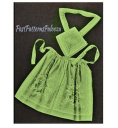 a green dress with an apron on it