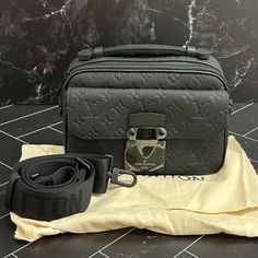 Measurements: 22 X 18 X 8 Cm (Length X Height X Width) Black Monogram-Embossed Taurillon Cowhide Leather Epi Leather Trim And Lining Matte Black Hardware S Lock Magnetic Closure Large Front Pocket Large Zipped Compartment Inside Flat Pocket Strap: Removable, Adjustable Strap Drop: 33.0 Cm Strap Drop Max: 60.0 Cm Come With Dust Bag, And Box Black Monogram Canvas Satchel Shoulder Bag, Black Monogram Canvas Shoulder Bag With Dust Bag, Luxury Travel Shoulder Bag With Gunmetal Hardware, Luxury Shoulder Bag With Gunmetal Hardware For Travel, Black Monogram Canvas Shoulder Bag For Business, Business Black Monogram Canvas Shoulder Bag, Luxury Black Monogram Canvas Shoulder Bag, High-end Black Monogram Canvas Bag, Black Monogram Canvas Travel Bag