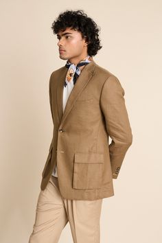 Khakhi blazer in a linen base with notch lapel collar, 2 cargo pockets, 1 barchetta pocket and loop detail at the collar.
Components: 1
Neckline: Notch Lapel
Sleeve Type: Long
Fabric: 100% Linen
Color: Beige
Other Details: 
Vented back
Sleeves with button closure
Unlined jacket
Closure: Button front
Note: The scarf, inner T-shirt and pant worn by the model is not for sale
Occasion: Cocktail and Reception - Aza Fashions Business Linen Outerwear With Pockets, Timeless Linen Blazer With Lapel Collar, Semi-formal Spring Tweed Jacket With Pockets, Spring Semi-formal Tweed Jacket With Pockets, Linen Outerwear With Patch Pockets And Suit Collar, Business Casual Linen Outerwear With Patch Pockets, Linen Outerwear With Patch Pockets For Business Casual, Brown Sport Coat With Welt Pockets For Spring, Spring Brown Sport Coat With Welt Pockets