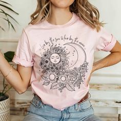 Hippie T-shirt for women, Celestial shirt, Astronomy Shirt, Floral shirt with sun and moon We use Bella Canvas shirts and recommend following our size chart for accuracy. The shirts are unisex and fit true to size. This shirt is NOT an oversized shirt. If you are looking for an oversized look, please consider sizing up 1-2 sizes. The model in the picture is wearing size 2XL. The shirts are comfortable and of light fabric. Great for any occasion and season. CARE INSTRUCTIONS Machine wash in warm Trendy Spring Tops With Moon Print, Summer Graphic Tee With Moon Print, Summer Moon Print Graphic Tee, Casual Summer T-shirt With Sun And Moon Design, Spring Graphic Tee With Moon Print, Summer Crew Neck T-shirt With Sun And Moon Design, Spring Moon Print Graphic Tee, Casual Sun And Moon Design Short Sleeve T-shirt, Cotton Sun And Moon Design T-shirt For Summer