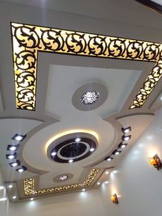 the ceiling is decorated with intricate designs and lights