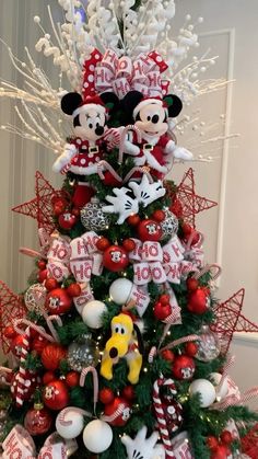 a christmas tree with mickey and minnie mouse decorations