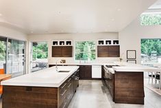 a large kitchen with an island in the middle