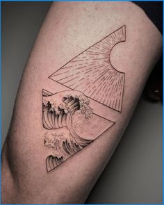 a man's leg with a wave and sun tattoo on the side of his arm