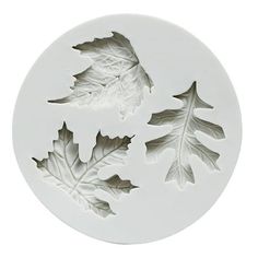 three leaf molds on a white background