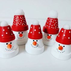 six snowmen with red hats and white dots on them