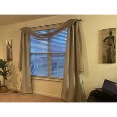 a living room with a piano and window