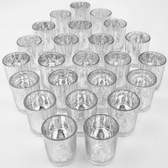 a bunch of glasses that are sitting in the middle of a pile on top of each other