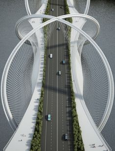 an aerial view of a bridge with cars driving on it and trees growing along the sides