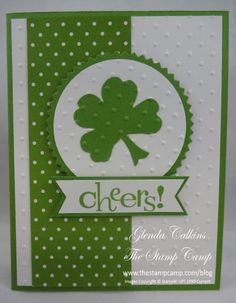 a green and white card with a shamrock on it