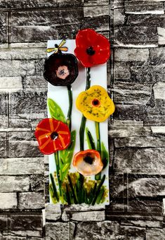 an art piece with flowers painted on it