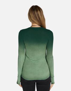 Made in LA 95% Siro Viscose 5% Spandex Wash Cold, Lay Flat to Dry ML Signature Soft Rib Knit Fabric Thumbhole Cutouts Fitted Silhouette Reactive Dye Stretch Fit Model & Fit Info Modeled in Size S Fitted Tee, Size Up If Unsure Height: 5' 9" / Waist: 23" / Bust: 31" / Hip: 34" Green Fitted Long Sleeve T-shirt, Stretch V-neck Tops With Thumbholes, Fitted Green Tops With Thumbholes, Green Stretch Long Sleeve Top With Crew Neck, Green Casual Long Sleeve Top For Layering, Casual Green Long Sleeve Top For Layering, Green Stretch T-shirt For Fall, Green Stretch Long Sleeve Knit Top, Trendy Tops With Thumbholes For Loungewear