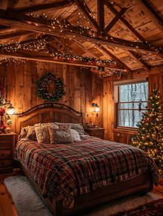 a bedroom decorated for christmas with lights on the ceiling and wood paneled walls, along with a bed covered in plaid blankets