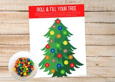 a christmas tree is shown next to a bowl of candy on a wooden table with the instructions for roll and fill your tree