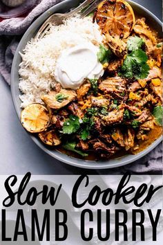 slow cooker lamb curry in a bowl with rice and cilantro on the side