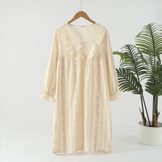 Experience elegance and comfort in our pastoral cotton nightgown, featuring double gauze layers, intricate lace, and bow details, perfect for stylish relaxation. Feminine Delicate Lace Nightgown For Loungewear, Feminine Delicate Lace Loungewear Dress, Cotton Ruffled Nightgown For Home, Cotton Ruffle Nightgown For Home, Cotton Nightgown With Ruffles For Home, Feminine Lace Nightgown For Sleep, Feminine Delicate Lace Nightgown For Sleep, Cotton Sleepwear With Delicate Lace For Loungewear, Cotton Nightgown With Lace Trim Long Sleeve