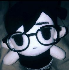 a stuffed animal with glasses on it's head