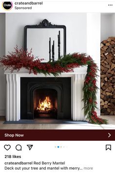 the fireplace is decorated with red berries and greenery