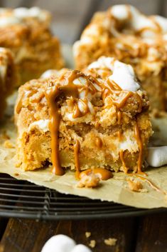 a piece of cake with marshmallows on top and caramel drizzle