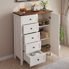 a white cabinet with drawers and some food