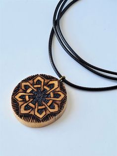 Pagan jewelry designed for good luck. Made of a tree branch that has dried and broken. Approximate dimension of pendant: height - 3.3cm width - 3cm rope lenght - min.40cm - max. 80cm (adjustable) Carved Pendant Amulet Necklace, Carved Pendant Necklace Amulet Style, Carved Amulet Pendant Necklace, Etched Amulet Style Round Pendant Jewelry, Etched Amulet Jewelry With Round Pendant, Etched Round Pendant Amulet Jewelry, Bohemian Engraved Jewelry As Gift, Bohemian Engraved Jewelry Gift, Carved Amulet Pendant Jewelry