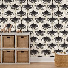 the wallpaper is black and white with an intricate design on it, along with wicker baskets