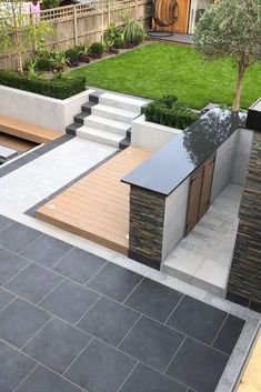 an outdoor patio with steps and seating area