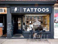 a tattoo shop with chairs and tables outside