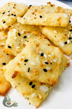 some food is on a white plate with black sesame seeds